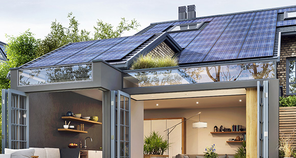 a house with black solar panels installed onto the roof